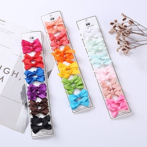 Set of colorful floral and solid grosgrain ribbon bow hair clips for girls hair styling