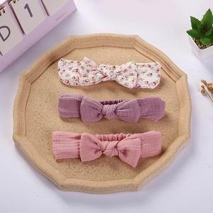 Three-piece baby headband set featuring bow ties in floral and solid cotton fabrics