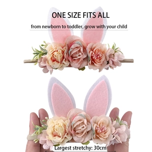 Detail showing the elastic stretch of the baby headband with rose floral and bunny ears