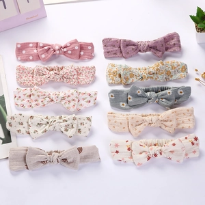 Set of 10 rabbit ear baby headbands with assorted floral and polka dot patterns