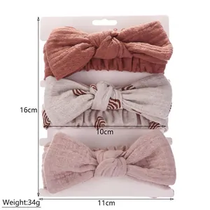 Three-piece baby bow headband set in soft cotton gauze with rustic red and floral patterns