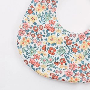 Double-sided floral cotton baby bib for drooling and feeding with soft white lining