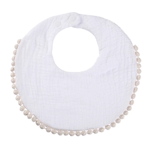 Detail of soft cotton gauze baby bib with fringe trim and adjustable snap buttons