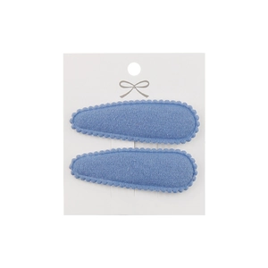 Detailed view of light blue fabric BB clips with wavy edges on a white card display