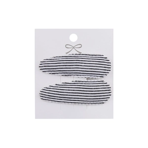 Detail of two-piece water drop hair clips featuring black and white striped fabric covering