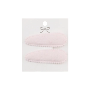 Detail of pink fabric drop-shaped hair clips with dotted texture on display card
