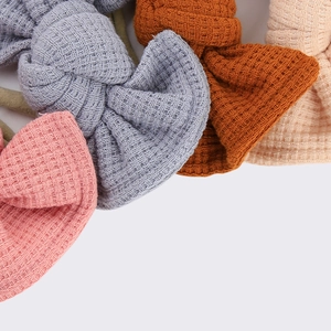 Detailed view of waffle knit fabric and textures on colorful baby bow headbands