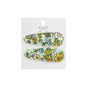 Close-up of floral fabric BB hair clips with sweet embroidery on white display card
