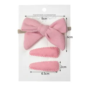 Pink faux cashmere 3-piece kids hair accessory set with large bow headband and drop clips