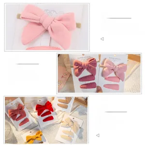 Detailed close-up of handmade faux cashmere hair bow set with soft velvet texture