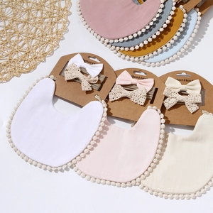 Soft cotton muslin baby bib set with matching lace bow headband in macaron colors