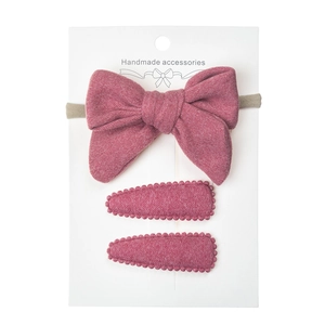 Three-piece pink faux cashmere baby headband and teardrop hair clip set on display card