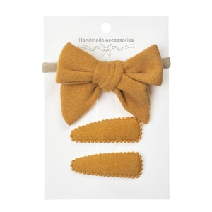 Detailed set of handmade ginger yellow wool hairband and wavy teardrop clips on card
