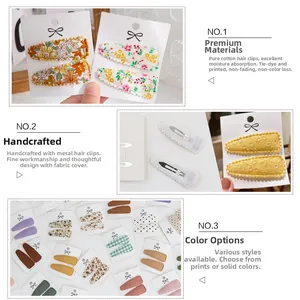 Detail view of handmade floral cotton BB clips set showing fabric texture and metal grip