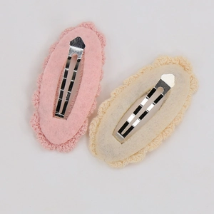 Detailed back view of crochet lace hair clips showing metal BB clip and felt lining
