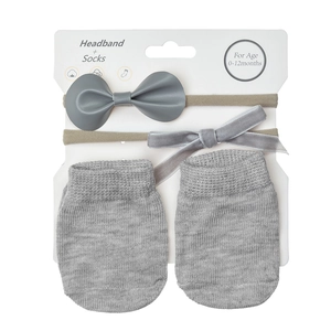 Three-piece baby gift set with gray knitted socks and two bow headbands for age 0-12 months