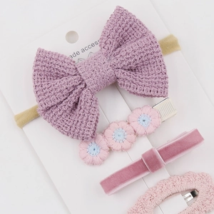 4-piece set of knitted kids hair accessories featuring purple bows and pink flower clips