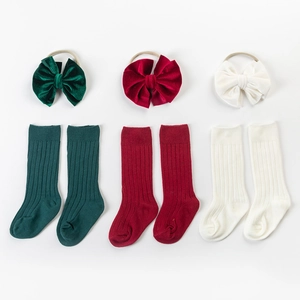 Velvet bow headband and ribbed cotton socks set for babies in green, red, and beige
