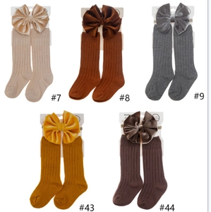 Infant ribbed cotton socks and velvet bow headband set in multiple neutral colors