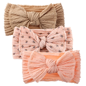 Three-pack of soft baby headbands featuring ribbed texture and large bow details