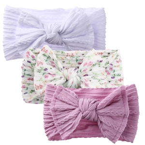 Three-pack soft nylon baby headbands with ribbed knit texture and floral patterns