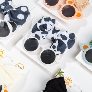 Kids panda sunglasses and soft bow headband set featuring cow print and polka dot patterns