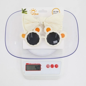 Toddler accessory set with knit bow headband and panda ear sunglasses weighing 40g