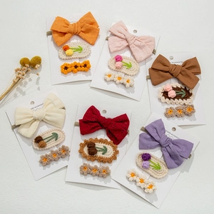 Handmade 3-piece knitted flower hair clip set for kids in various soft colors