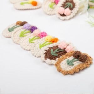 Handmade crochet flower hair clips in various colors including tulip and cherry designs