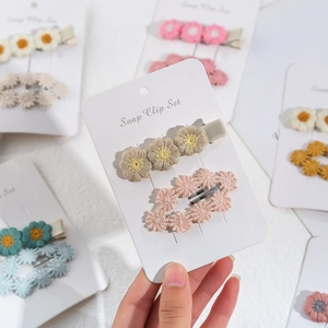 Set of two cute daisy embroidered cotton hair clips for baby girls in pastel colors