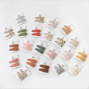 Close-up of embroidered lace BB hair clips for girls in various Morandi solid colors