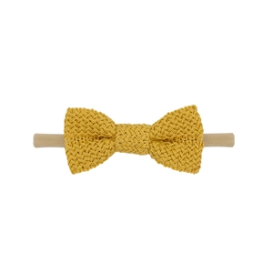 Detail of ginger cotton knitted bow on soft nude nylon stretchy baby headband