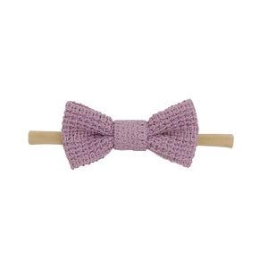 Detail of lavender cotton knit bow headband with waffle texture for baby girls