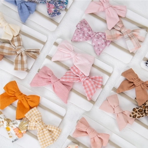 Three-piece baby bow headband set with floral prints and braided nylon in various colors