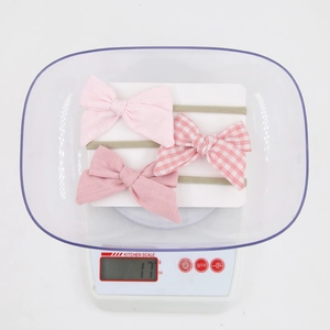 Three-piece baby bow headband set showing lightweight 17g design for newborns