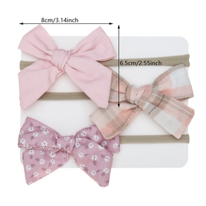 Three-piece baby nylon headband set with soft cotton bows in pink and floral patterns