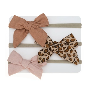 Three-piece baby bow headbands featuring leopard print and soft nylon elastic straps