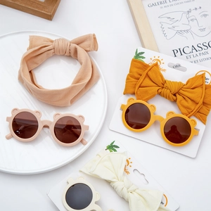 Kids round bear ear sunglasses and knotted bow headband set in various neutral colors
