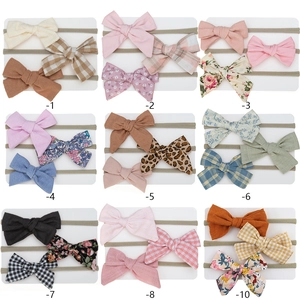 Three-piece baby nylon headband set featuring various bow designs and printed patterns
