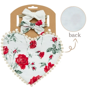 Detail view of cotton baby bib with rose prints and matching bow headbands set