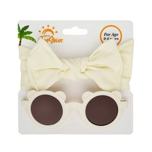 Detail of baby cream nylon bow headband and bear ear sunglasses on display card