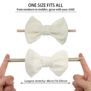 Detail showing the ultra-soft jacquard fabric and high elasticity of the baby headband