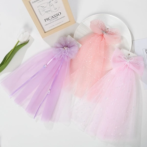 Detailed set of three sparkling tulle hair clips with pearls and sequin bows for girls