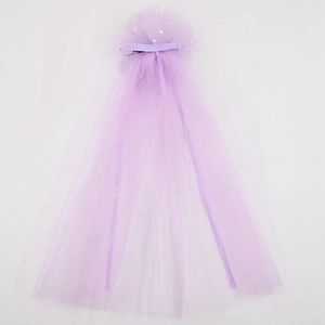 Detail of purple tulle hair clip for girls with glitter accents and flowing chiffon veil