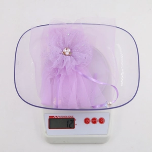 Macro detail of purple mesh flower hair clip with pearls and rhinestones weighing 12g