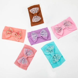 Set of 6 elastic ribbed baby headbands featuring floral print fabric bows in soft colors