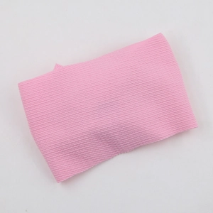 Close-up of pink waffle texture fabric hairband with soft knitted square pattern