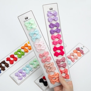 Macro detail of colorful double-layered grosgrain ribbon bow hair clips set for girls