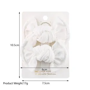 Set of 2 white lace fabric bow hair clips for girls on display card size 10.5x8cm