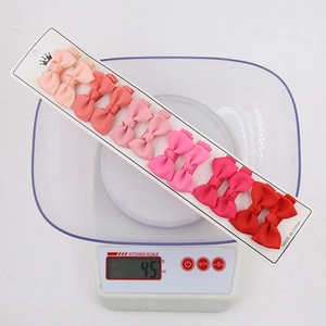 Set de 10 pinzas para el cabello con lazos hechos a mano en tonos degradados rosa y rojo